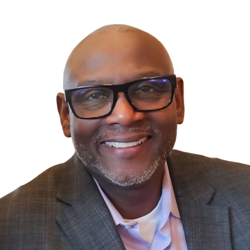 Smiling man wearing glasses and a suit jacket.