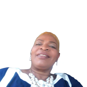 Smiling woman with a pearl necklace and blue and white top.