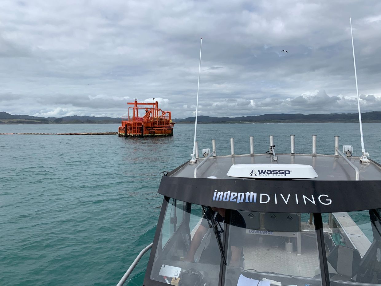 Indepth Diving boat with large buoy in the background