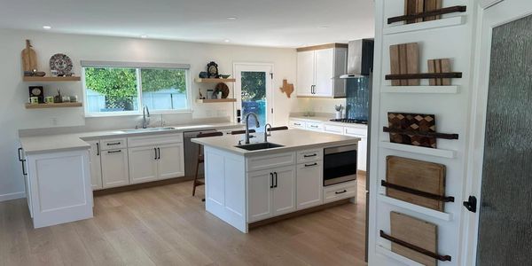 Face Frame cabinets with shaker style doors. White oak trim and floating shelves.