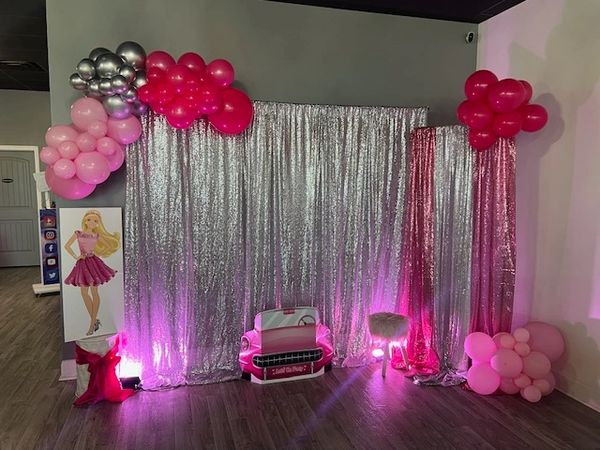Barbie themed backdrop shimmer panels in pinks and silver at Suite Events. 