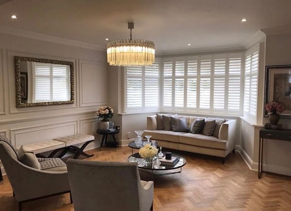 Elegant living room with corner window shutters