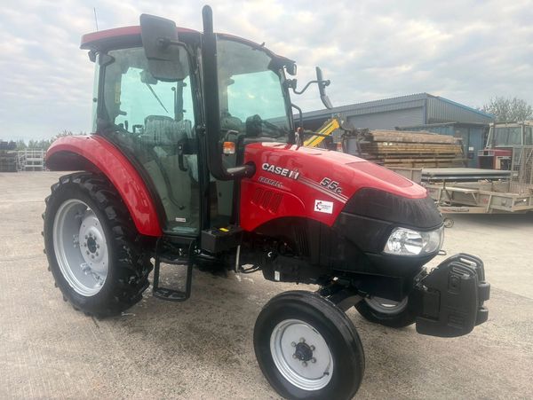 Red Case IH tractor parked on concrete.
