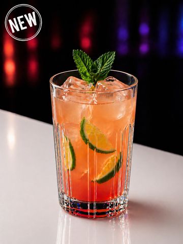 A refreshing iced cocktail garnished with mint and lime slices.