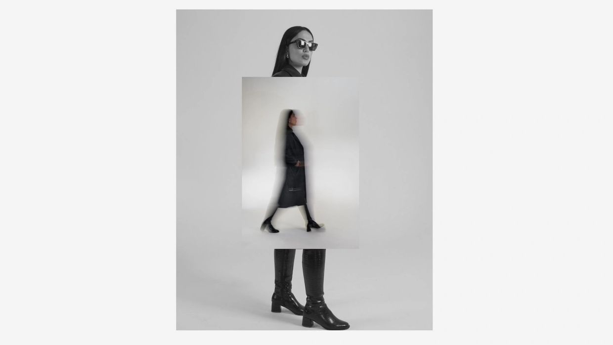 Stylish woman in black coat and boots with a creative double exposure effect.