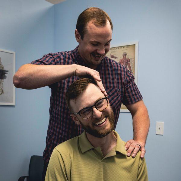 Kuss Chiropractic - Anoka Minnesota, Dr. Kuss stretching a patient before chiropractic adjustments.