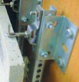 Close-up of a metal latch mechanism attached to a wooden surface.