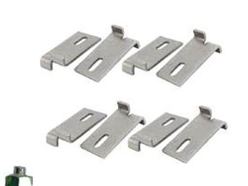 Set of metal clips with hooks and slots, likely for mounting or securing.