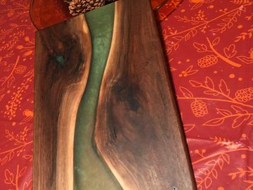 Black walnut cutting board with green pigmented epoxy