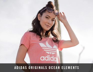 Woman wearing a pink Adidas Originals t-shirt.