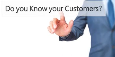 Businessman pointing at 'Do you Know your Customers?' text.