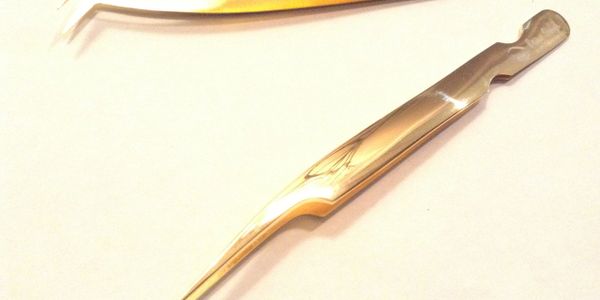 image of Brow Queen professional gold tool tweezers.