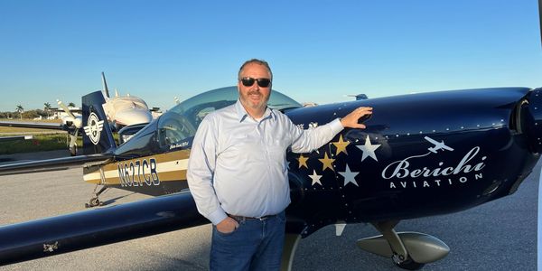 Sean Clayton, DUI Lawyer, in front of an Extra 300.
