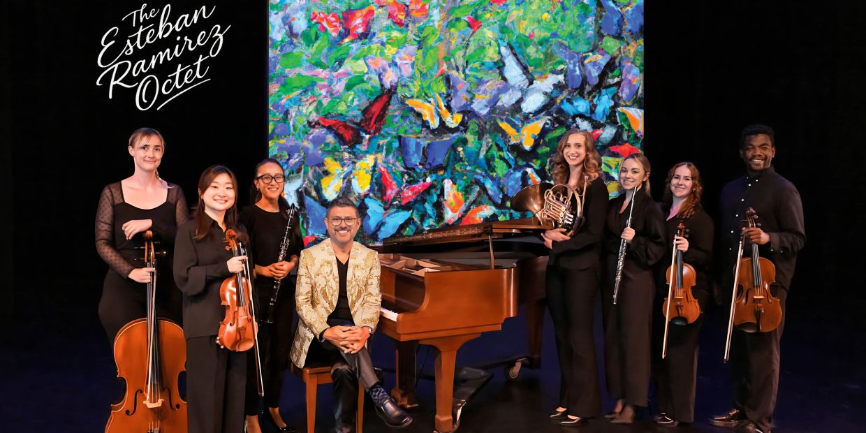 The Esteban Ramirez Octet poses with their instruments in front of a colorful painting.