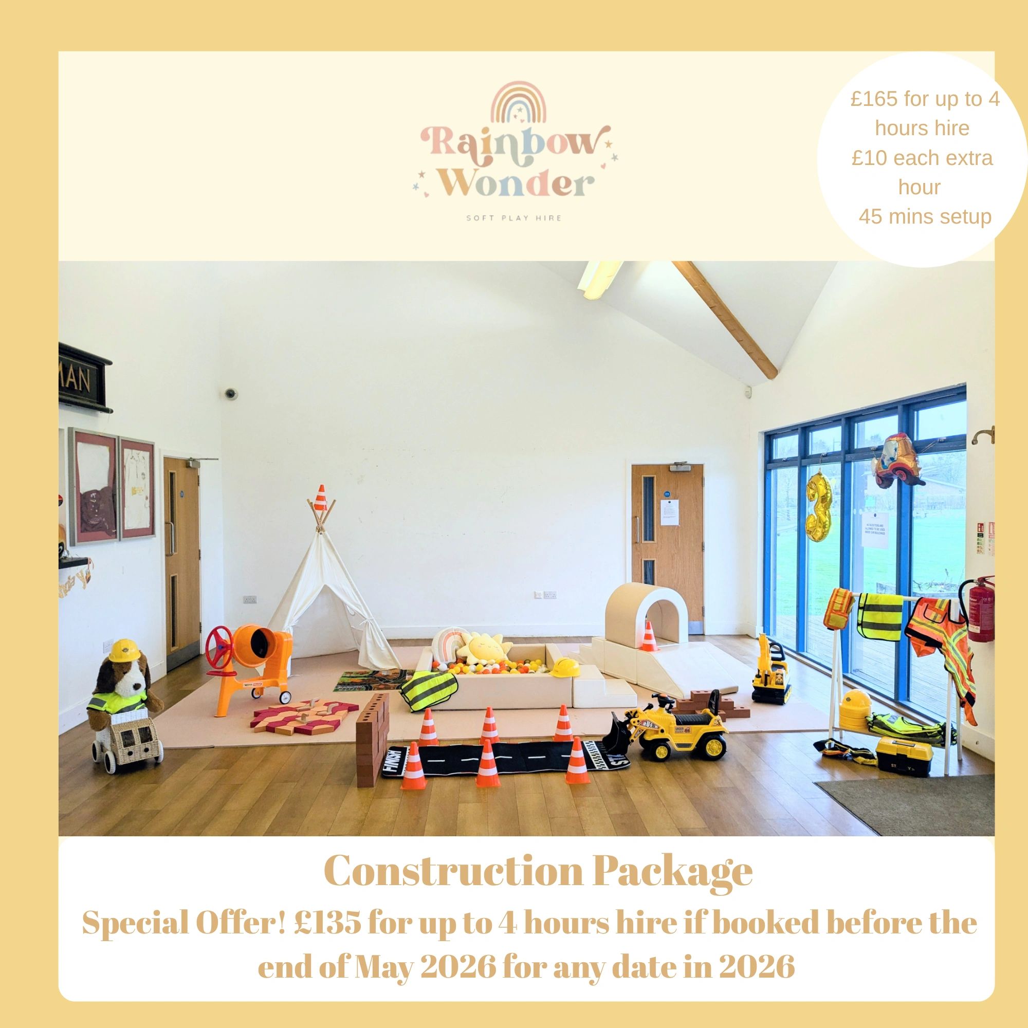 Indoor kids' play area with construction-themed toys and soft play equipment.