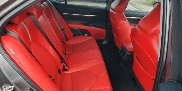 My Comfort rated car's rear seats have plenty of leg and head room with cheerful red leather seats a