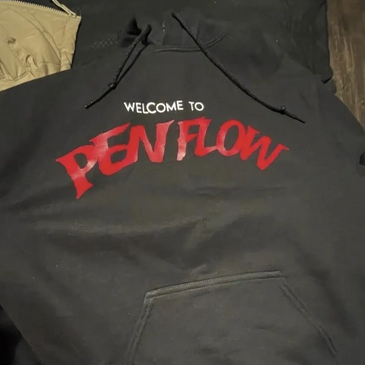 Black hoodie with 'WELCOME TO PEN FLOW' printed on it.