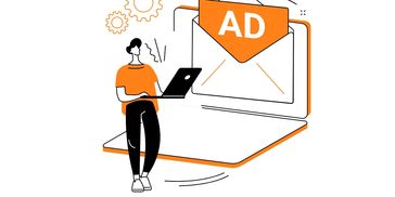 Person checking email ads on laptop with gears symbolizing settings.