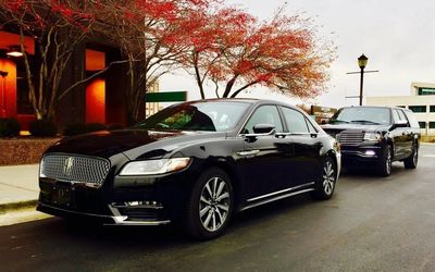 Sedan getting window tint in Troy, MI. Enhance privacy and heat control with mobile tinting.

