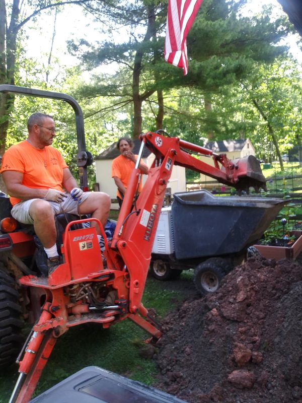 Labor Boys hard at work excavating for a new concrete pad!