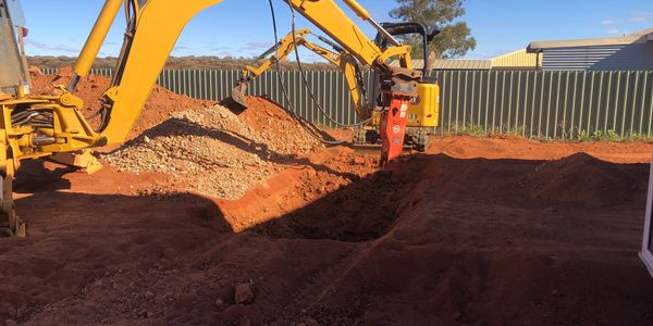 Excavator and Backhoe rock breaking septic tanks
