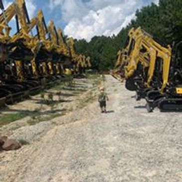 Our loaders and excavators ease site work in residential and commercial grading needs in Raleigh.