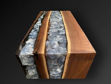 Custom waterfall coffee table with black walnut and epoxy rocks river table