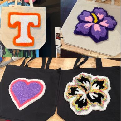 Four tote bags with colorful hooked designs including a 'T', flower, heart, and hibiscus.
