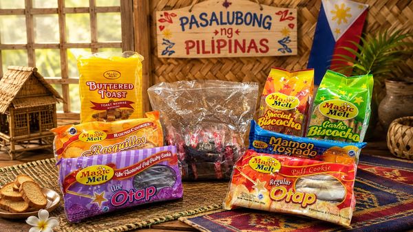 Assorted Filipino snacks displayed with a 'Pasalubong ng Pilipinas' sign in the background.