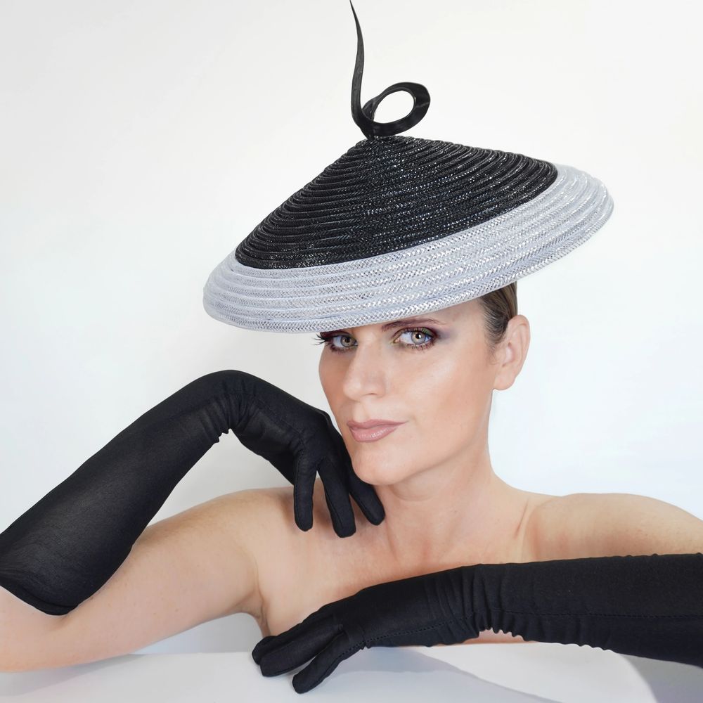 A fashion-forward luxurious handcrafted hat by Peacock Millinery.