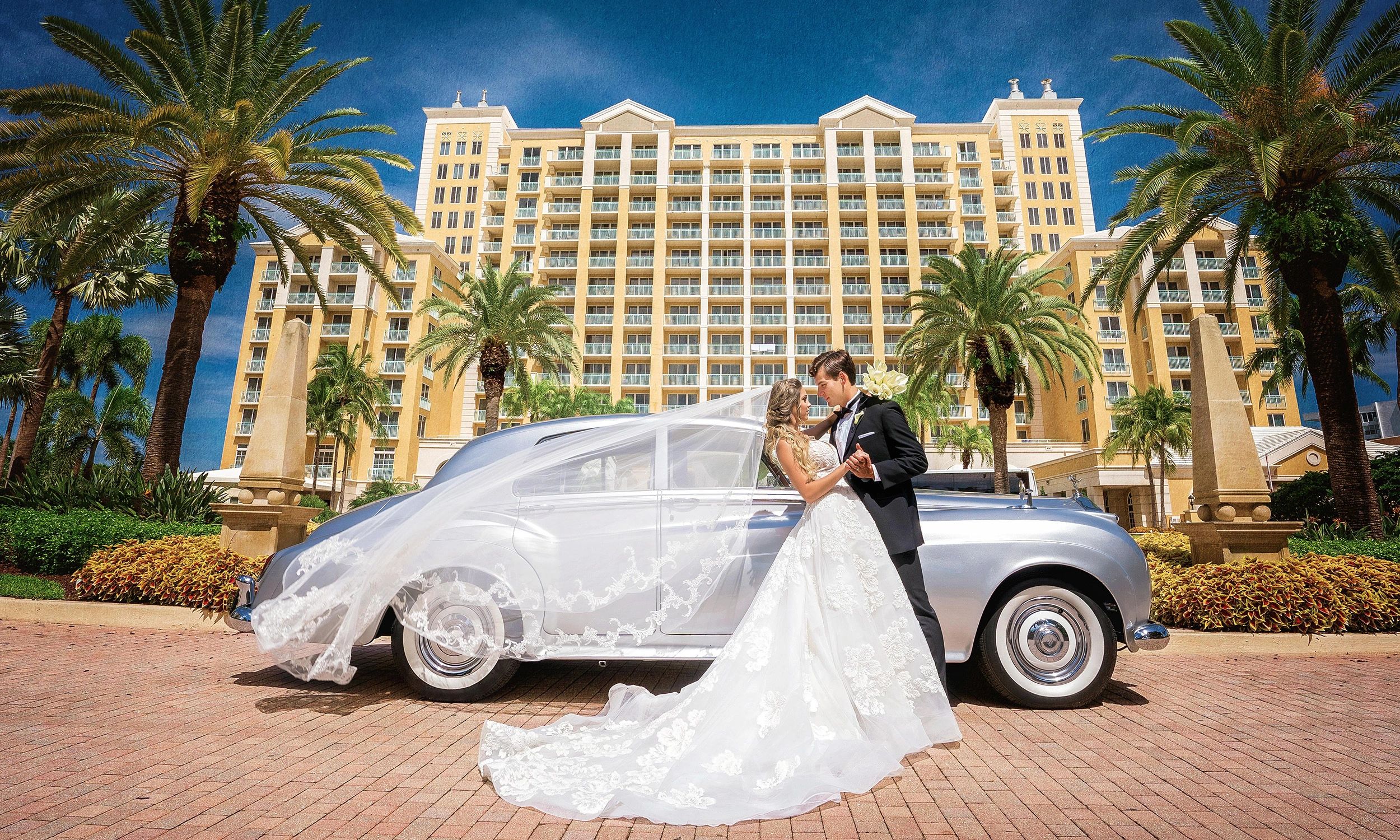 1960 Rolls Royce silver wedding classic car. Wedding at the Ritz Carlton in Miami 