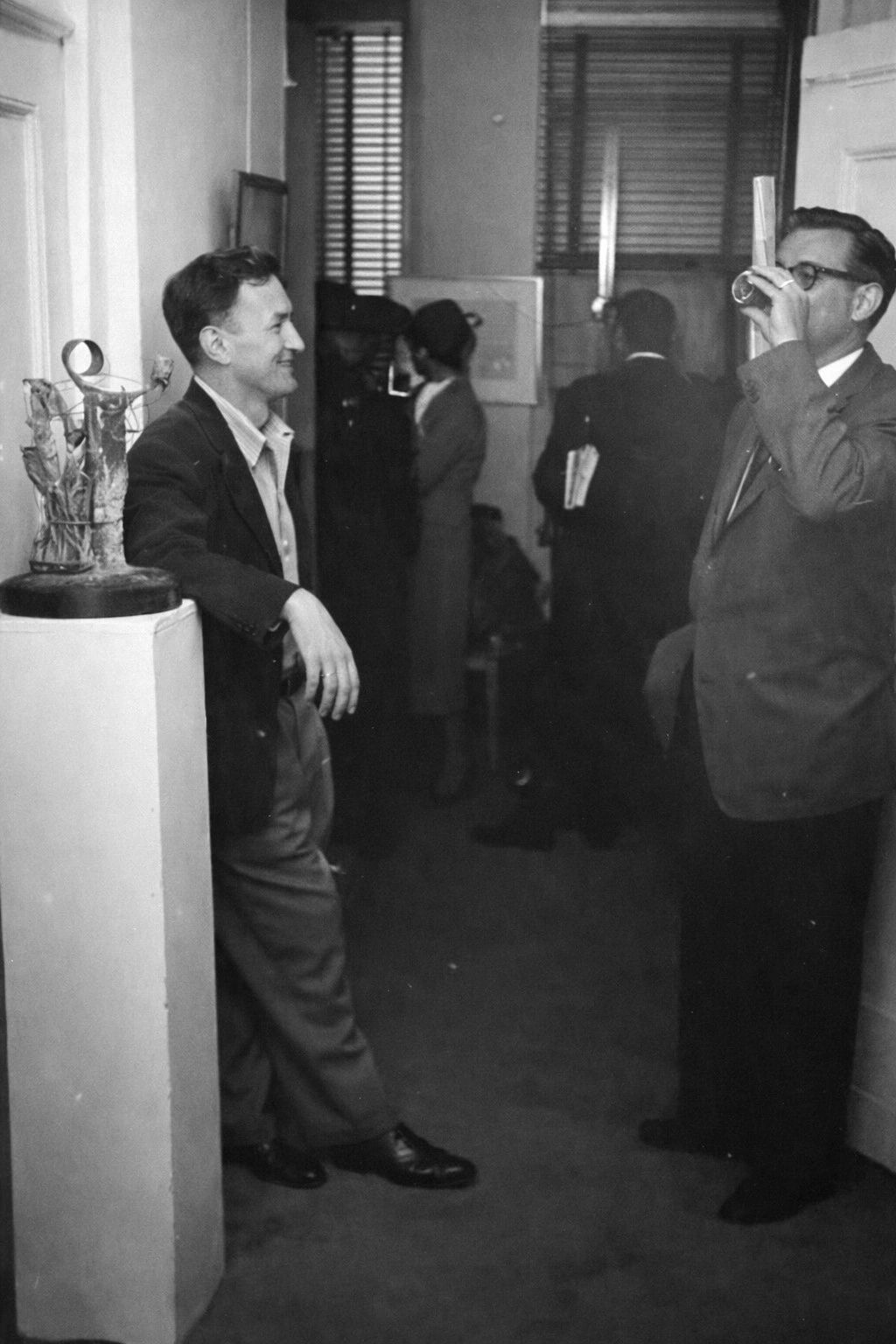Allen Gingsberg with artist Alan Wood-Thomas during his Carlebach Gallery show in NYC in 1955 