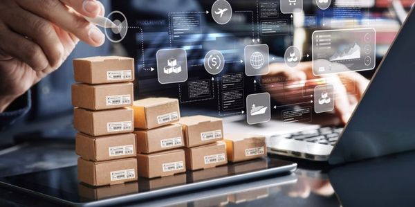 Stacked parcels on a tablet with logistics icons above.