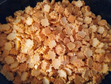 Golden brown cookies with a ridged, leaf-like shape.