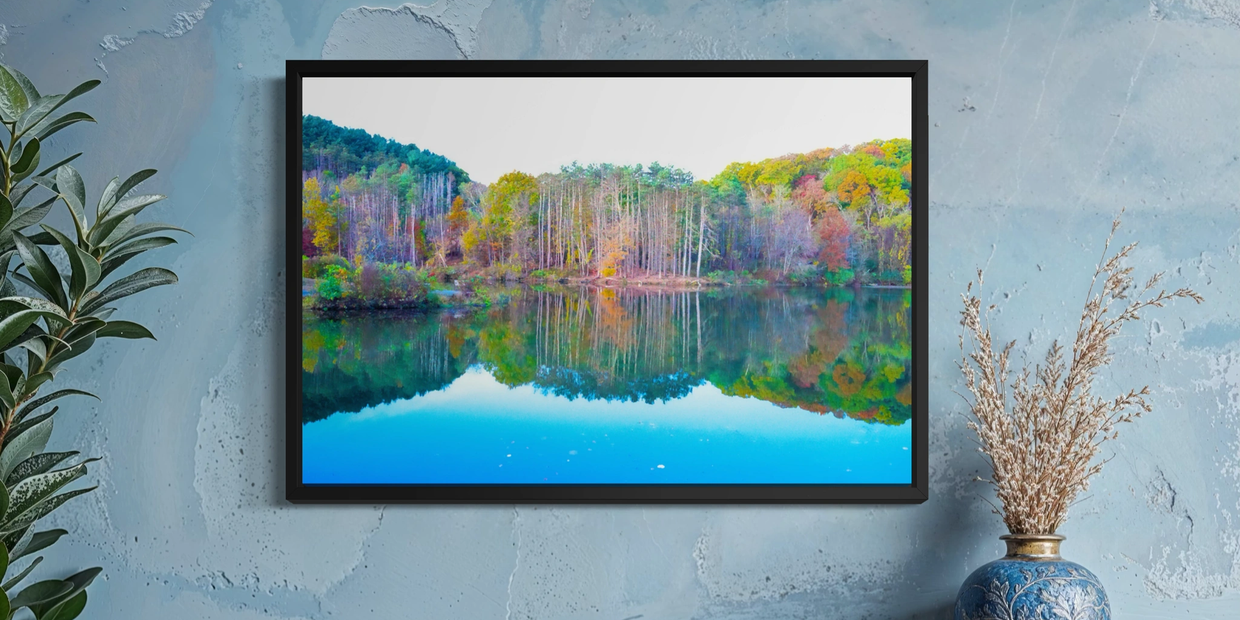 A colorful framed landscape photo with peaceful lake reflection.