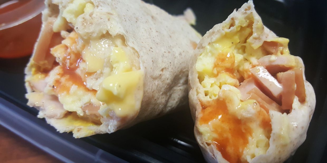 Breakfast burrito with hot sauce