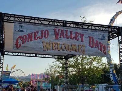 Conejo Valley Days welcome banner at festival entrance.
