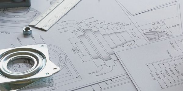 Mechanical part and ruler on technical engineering blueprints.