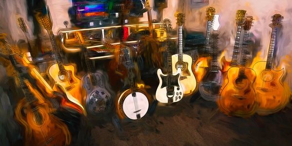 A collection of various string instruments arranged indoors.