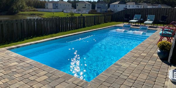 Sun Drenched Pools installation of a San Juan Fiberglass Pool Sully Blue Wylela Beach model