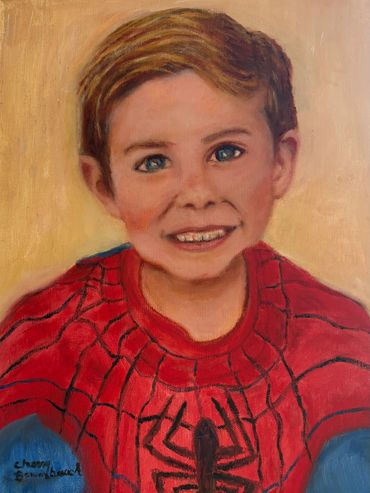 A painted portrait of a smiling boy in a Spider-Man costume.
