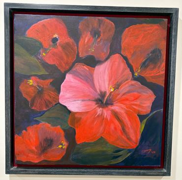 Framed painting of vibrant red and pink flowers with green leaves.
