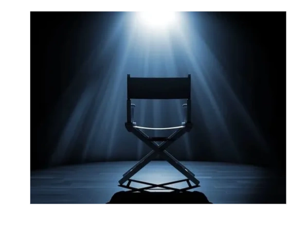 Director's chair illuminated by strong overhead spotlight.