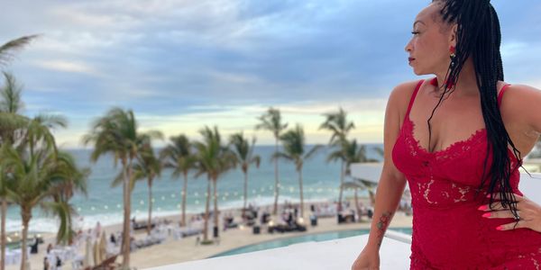 “Erica N. Smith smiling confidently as a travel and hospitality entrepreneur