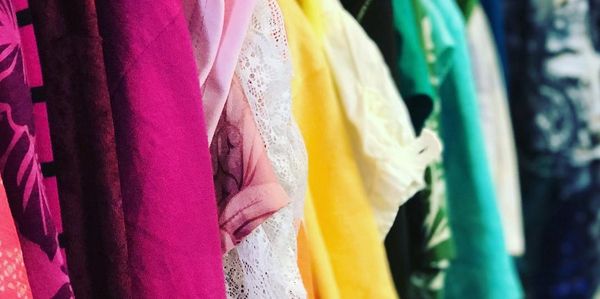 Closeup of colorful clothing on a rack