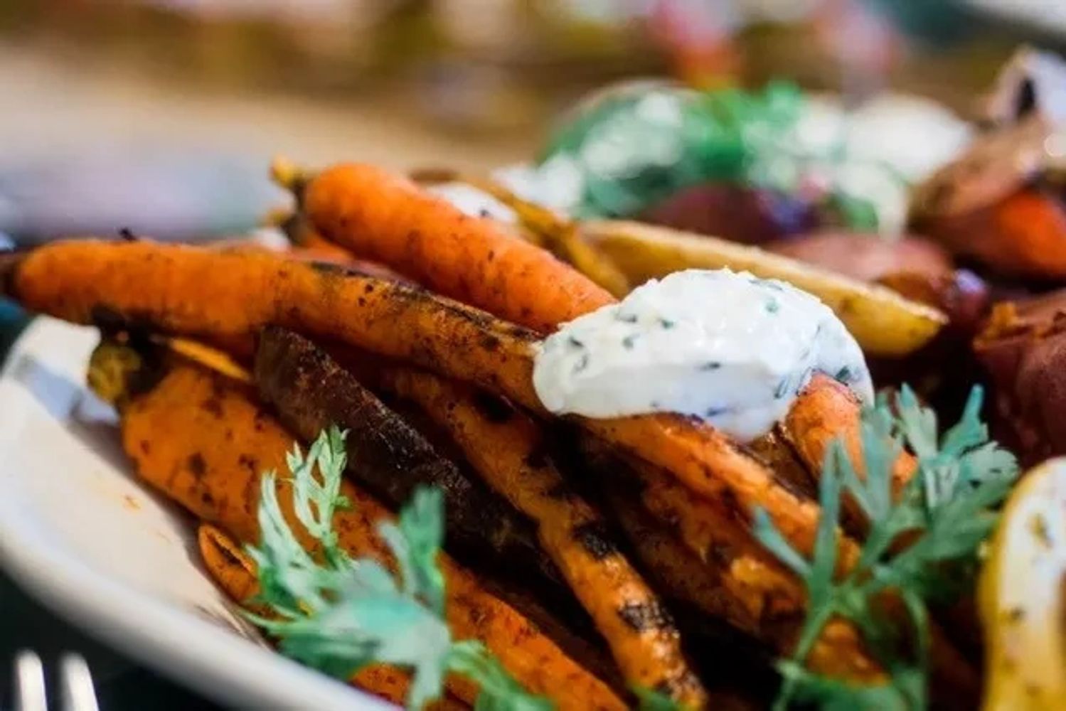 Grilled carrots with a chipped chive goat cheese.