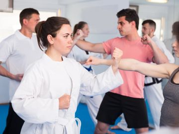 People practicing martial arts in a class.