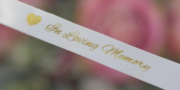Add a personalized ribbon to your arrangement for $7.00