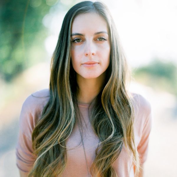 Portrait of a young woman with long hair.