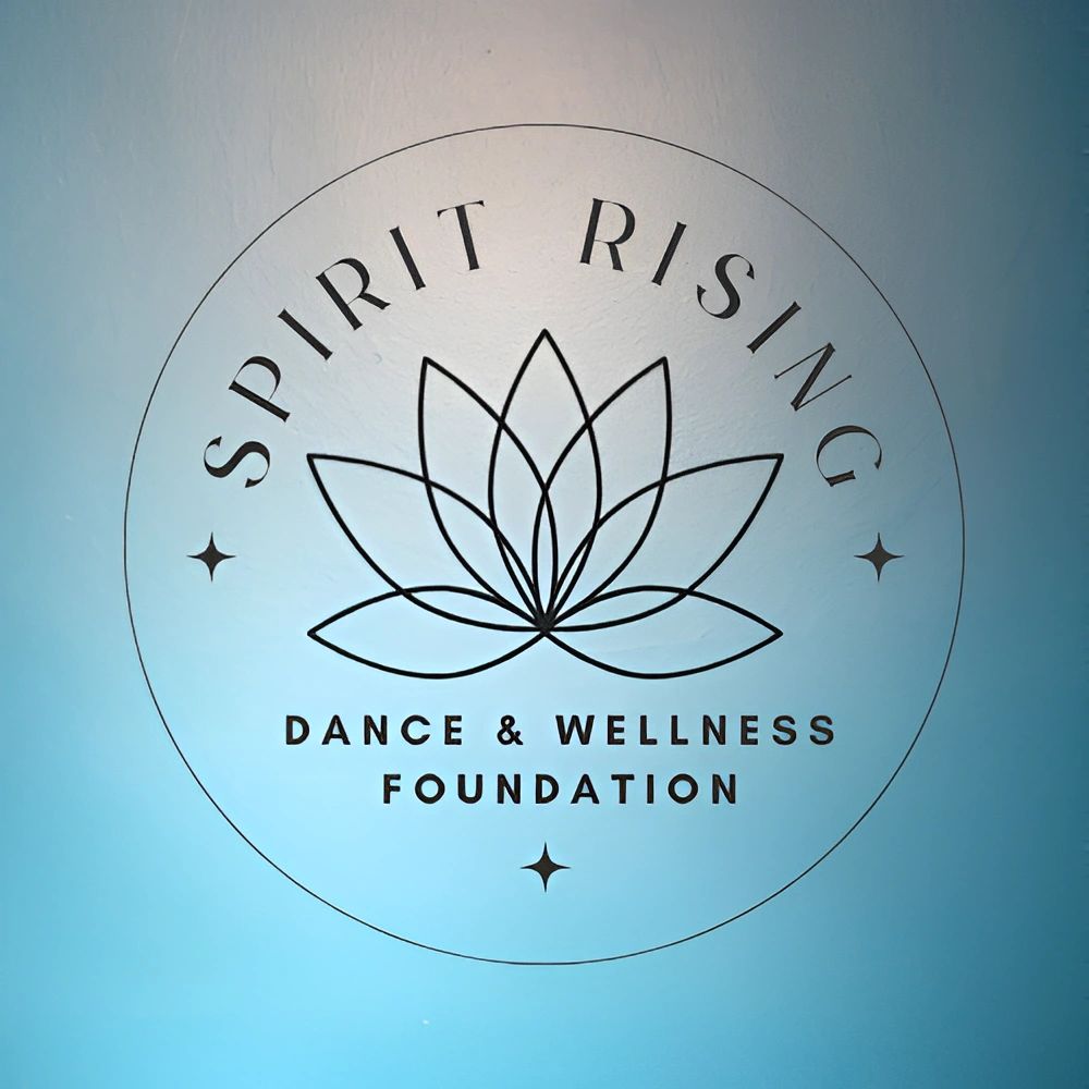 Logo of Spirit Rising Dance &amp; Wellness Foundation with a lotus design.